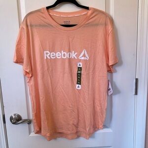 NWT Reebok XL peach high-low T-shirt w/ white logo.